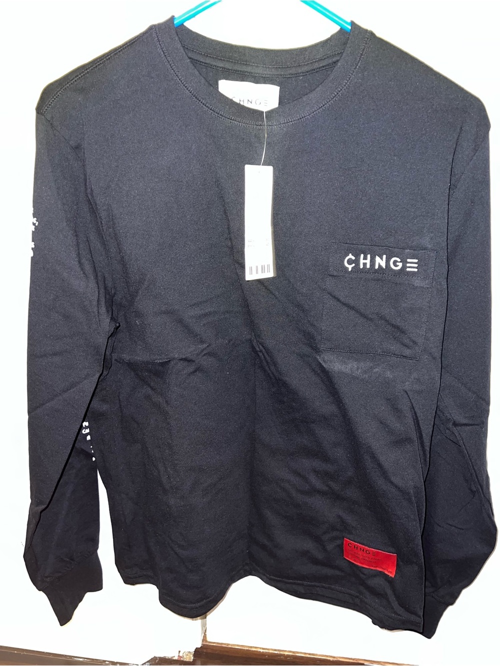 CHNGE Black Long Sleeve Pocket Tee with Red Tag